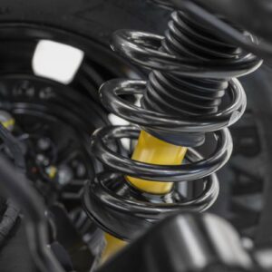 Closeup of a rear coil-over spring and available Bilstein long-travel position-sensitive shock absorber.