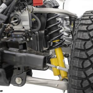 Closeup of the 2021 Bronco independent front suspension featuring two forged aluminum alloy A-arms and available Bilstein long-travel position-sensitive dampers with end-stop control valves.